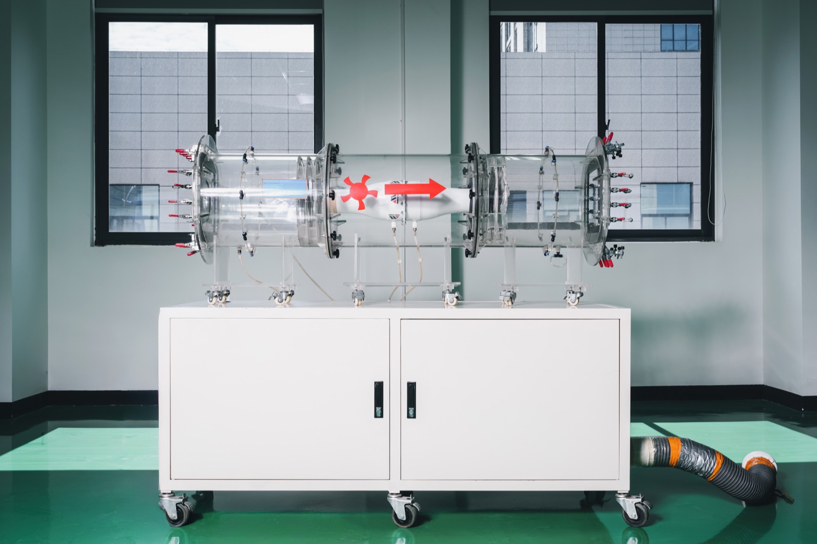 Wind tunnel test apparatus for measuring military cooling fan airflow and static pressure in a controlled laboratory environment