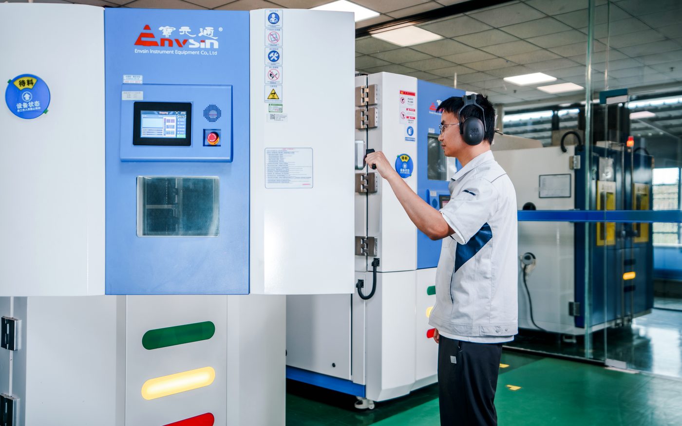 Perseus engineer operating a temperature and humidity chamber during cooling fan environmental testing